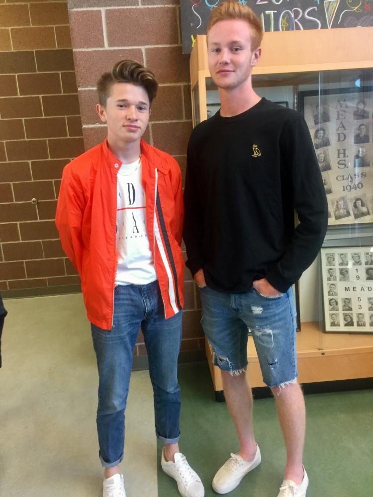 Seniors Tristan Anton & Connor McCawley pose in the commons, showing how they dress for success!