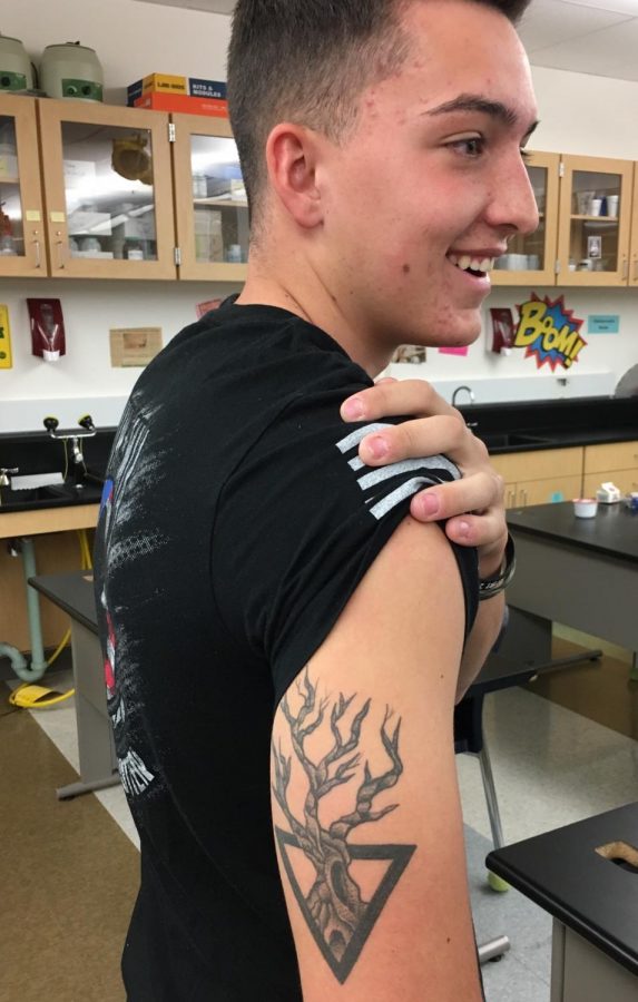 Senior, Jarrett Mastriona shows off his tricep tattoo. 