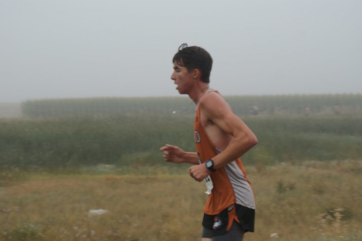 Sophomore Nick Scohy runs to the finish line at the Mead Stampede Cross Country race