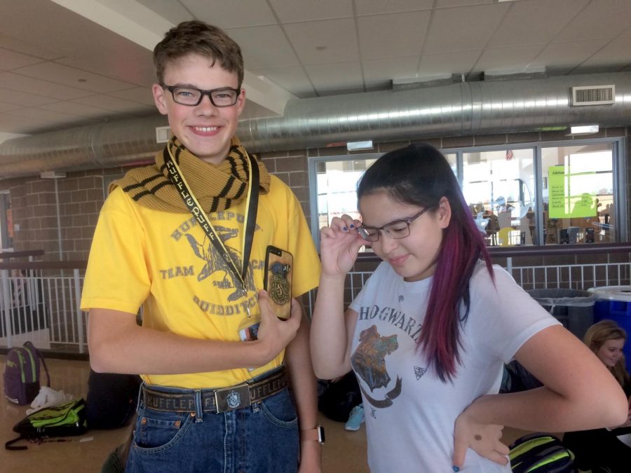 Sophomores Aiden Owen and Brandi Tracy pose wearing their Harry Potter merchandise.