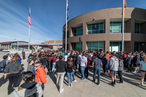Students watch from the window as peers walk out in memory of Parkland shooting