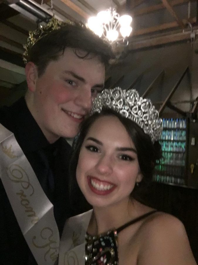 Big+smiles+from+prom+King+and+Queen+while+wearing+their+sashes.
