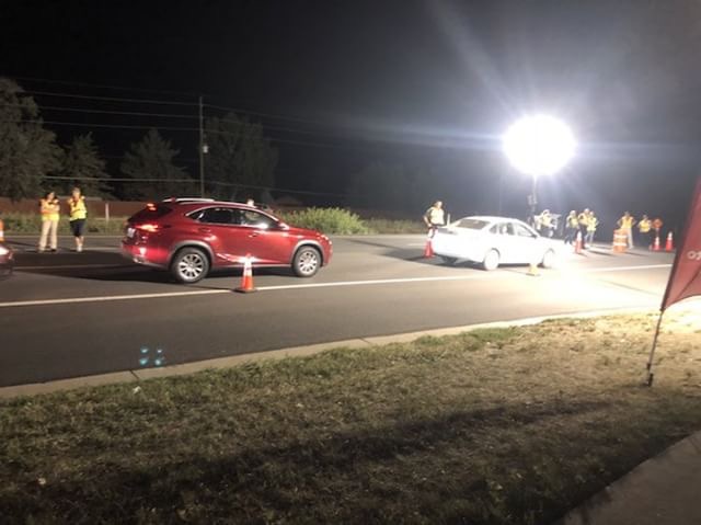All cars are stopped at the DUI checkpoint 