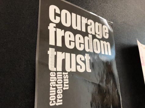 A poster hangs in the hallway of the D Wing encouraging freedom and trust. 