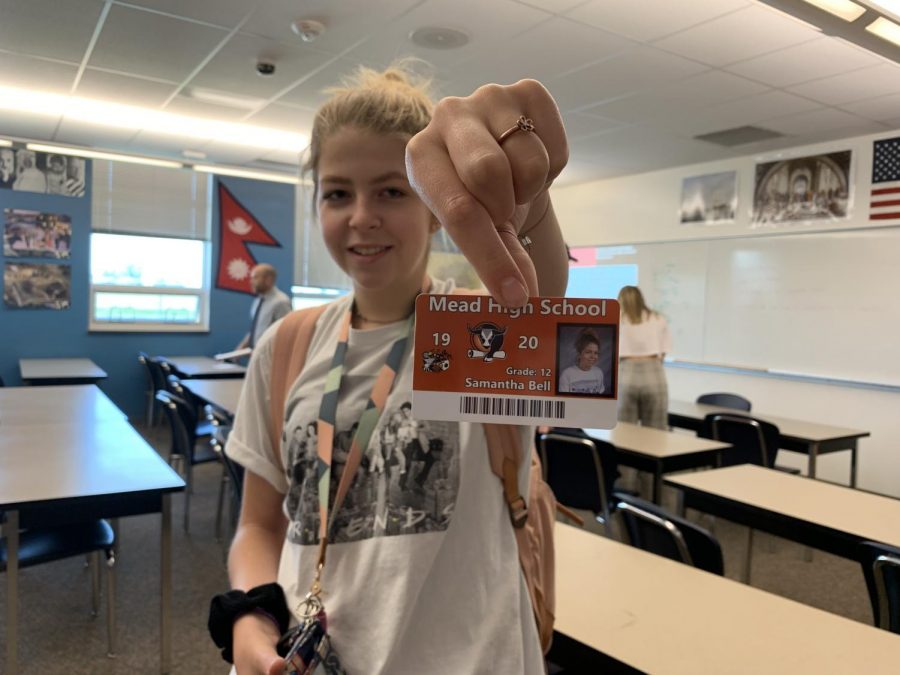 Senior Samantha Bell shows off her student ID saying, I’m just a senior who wanted to have a fun photo.
