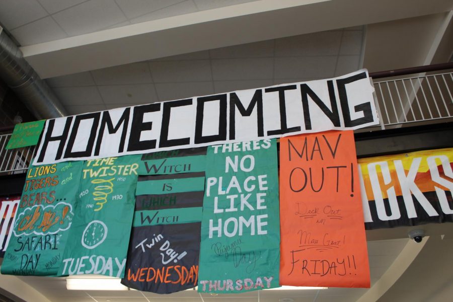 Student+Council+hangs+posters+reminding+students+of+sprit+week+festivities.+