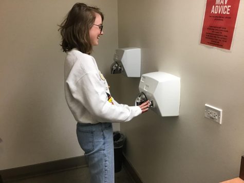 A happy Maverick uses a hand dryer in its best form