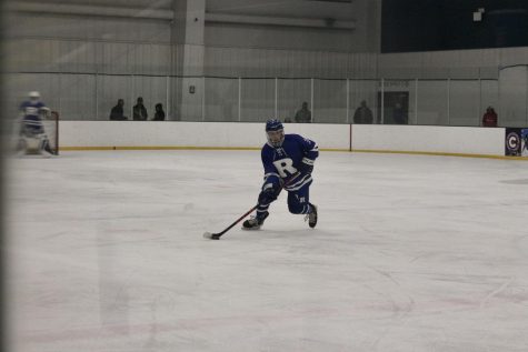 Bryson Carter (24) skates the puck up the ice during a game in November.