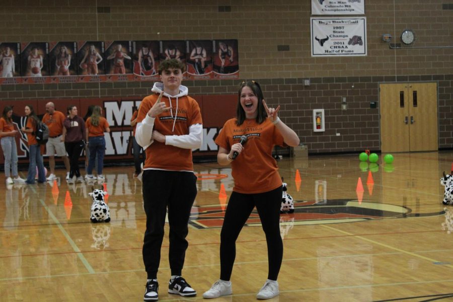 Seniors Nick Basson (23) and Maggie Oster (23) helped introduce new games during the assembly.