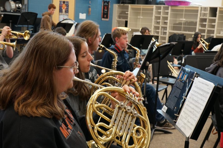 Concert band practices in the B-Wing.