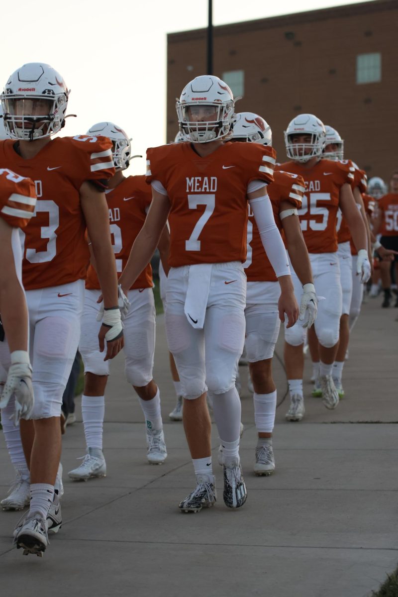Mead walks down the path to the football game before their home game against Durango