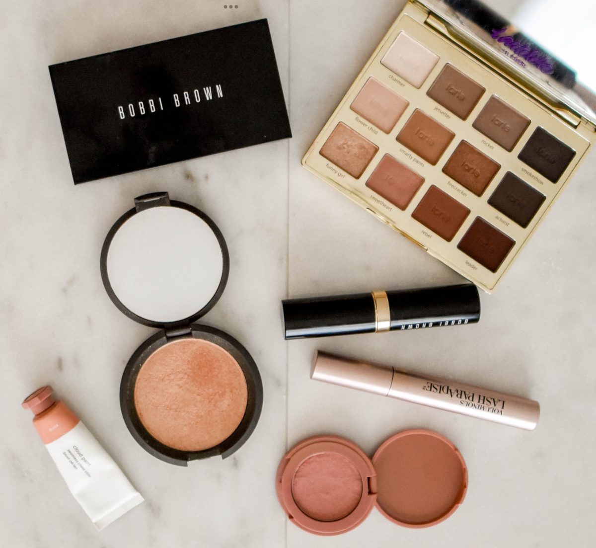 Make-up by Millie Bobbi Brown is displayed on a counter.