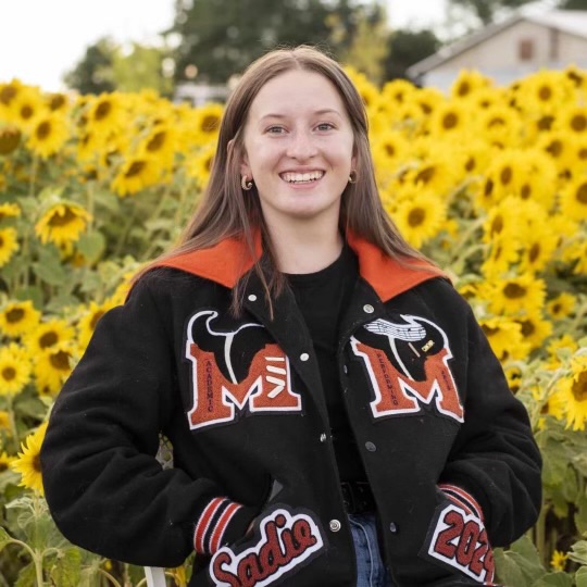Sadie Steen sports her decorated letterman jacket during a senior photo shoot. 