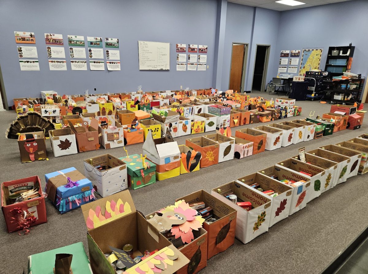 Table of Hope’s food boxes, decorated by students, for the annual Thanksgiving drive.
