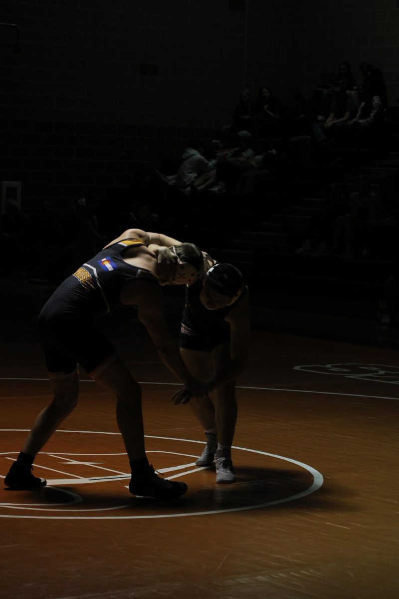 Kannon Garcia (‘24) grapples with Windsor opponent.