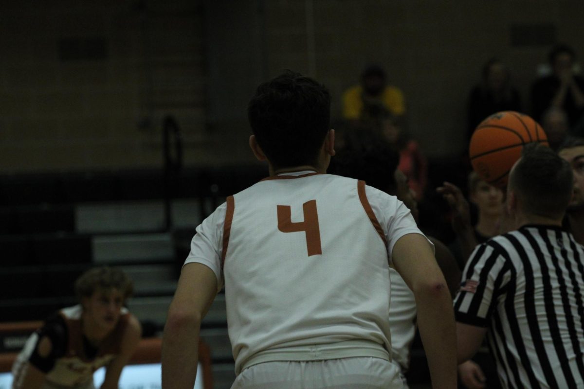 Matthew Angelo (25) awaits the tip-off against the Lakewood Tigers.