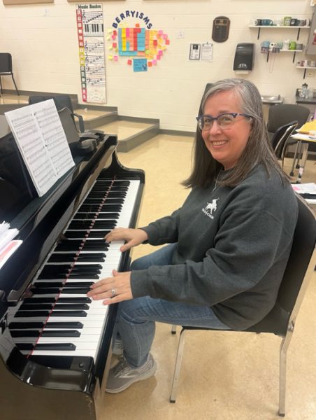Angela Reeder smiles while playing her piano, one of the many things she finds passion in.