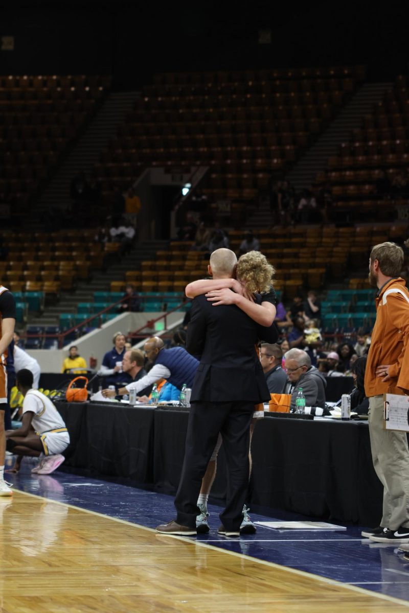 Mason Wilyard (‘24) hugs coach Darin Reese after a tough loss to Northfield.