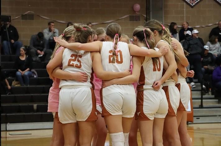 Mead+Girls+Basketball+huddles+together.