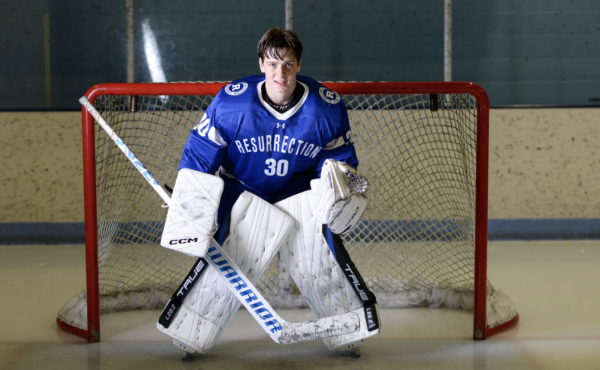 Lucas Witko (‘24) poses in his hockey gear for his senior photo