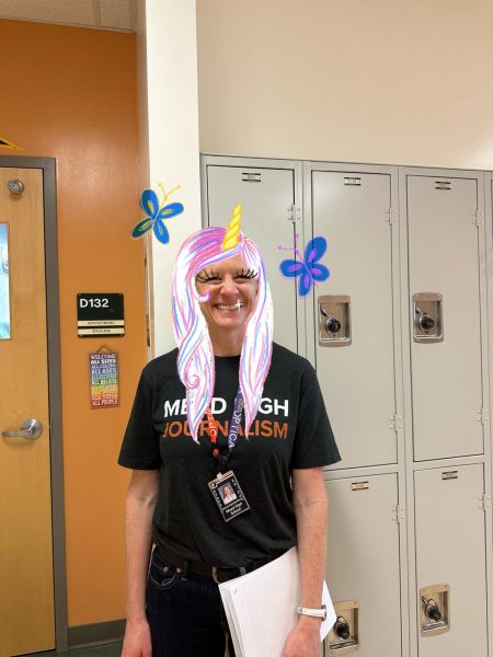 Ms. Sonnenberg smiling in front of her room 