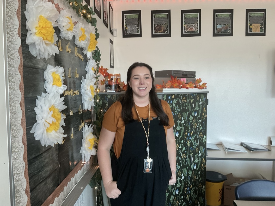 Ms. Gray smiling for a photo in her new classroom.