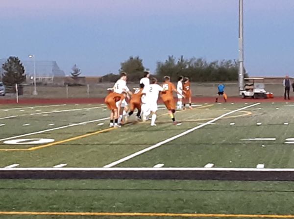 The Mavs are running to the ball to try and score their first goal of the game.