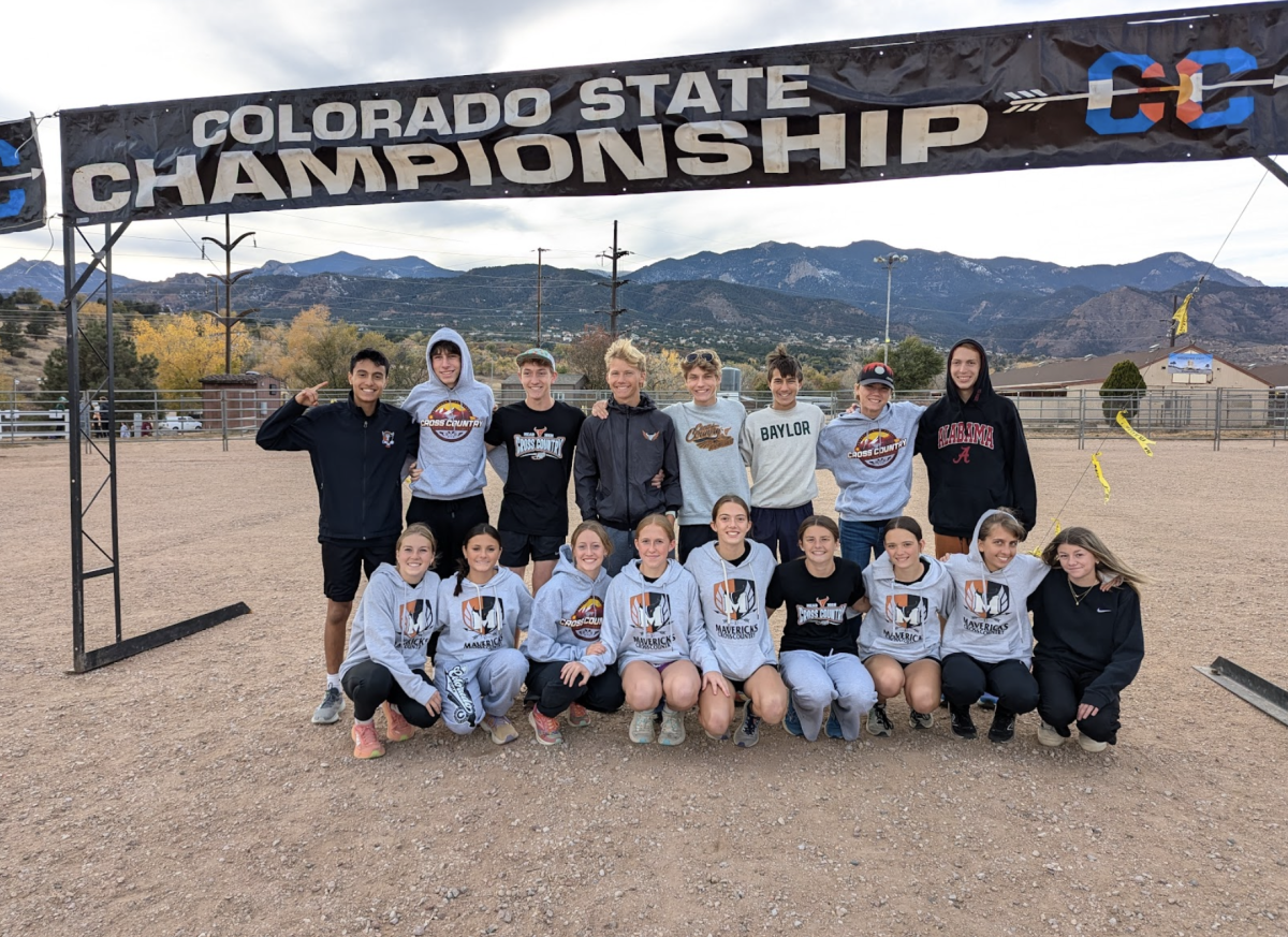 The boys and girls cross country teams pose for a photo at the state course.