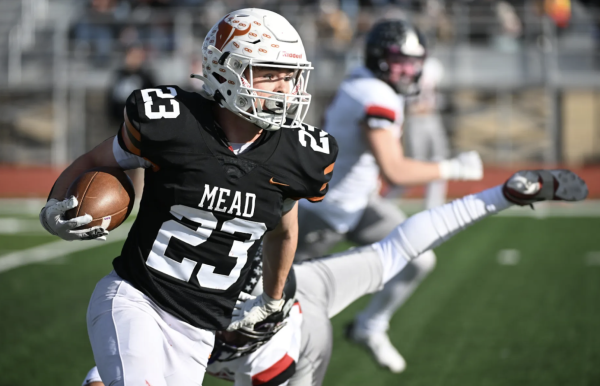 Ryan St. Aubin running the ball up field.
Image courtesy of "Margos Lens."