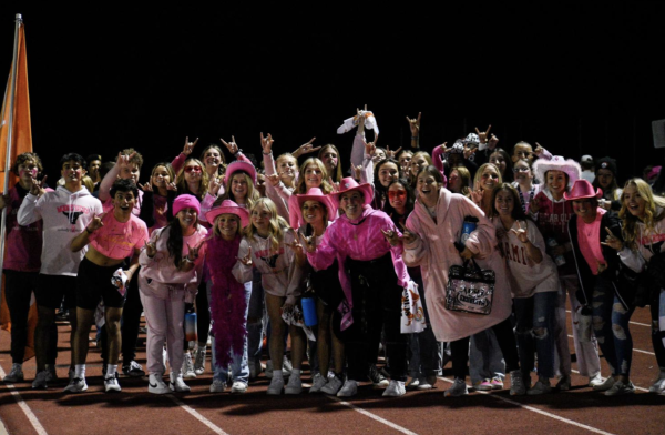 The student section celebrates after a 45-0 football victory against Denver North during the 2022 football season. 