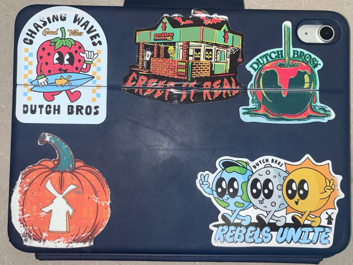 Chayce Morris (‘27) decorates her iPad with Dutch Bros stickers, expressing her love for the coffee establishment.