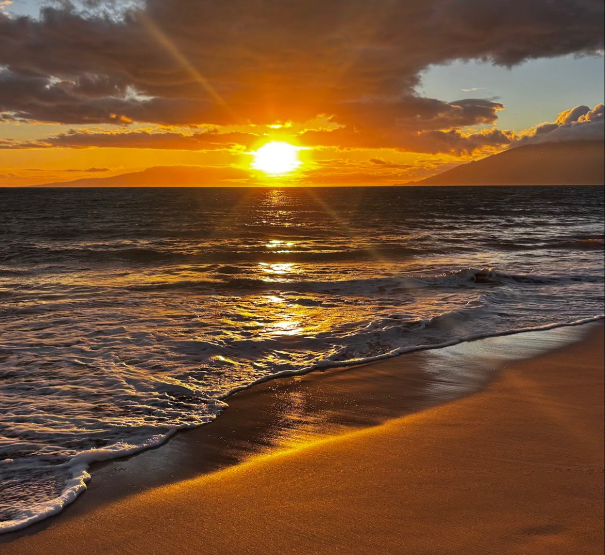 This sunset was one of my favorites because of how bright it was. The sand and water perfectly meet to make a very beautiful picture. 