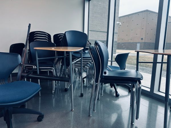 Abandoned stack of evil chairs plan their next attack.