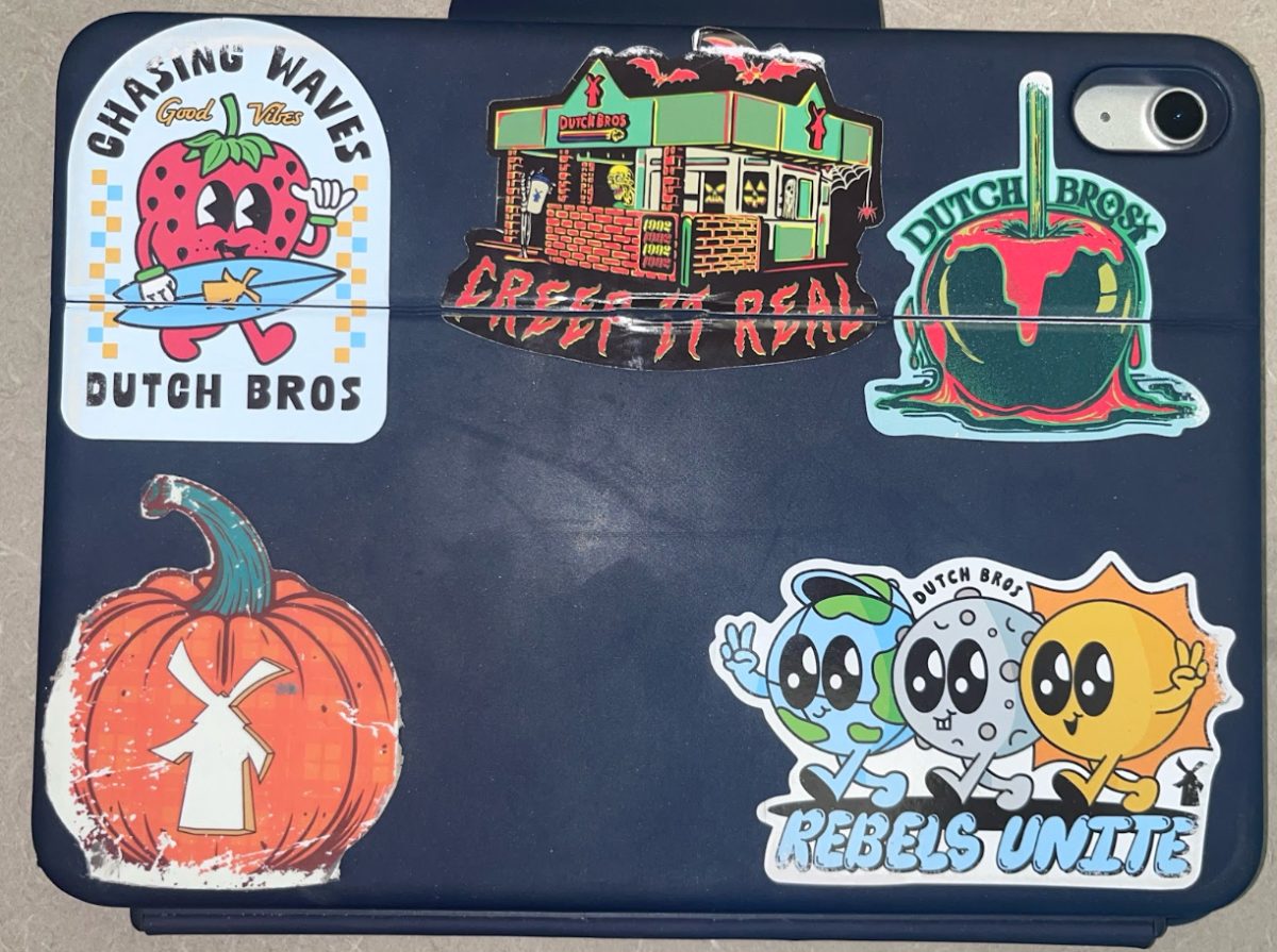 Chayce Morris (‘27) decorates her iPad with Dutch Bros stickers expressing her love for the coffee establishment.