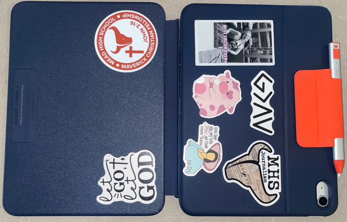 Brissa Mendez-Olivas (‘26) decorates her iPad with Maverick Christian Fellowship, Journalism, and other stickers for her interests.