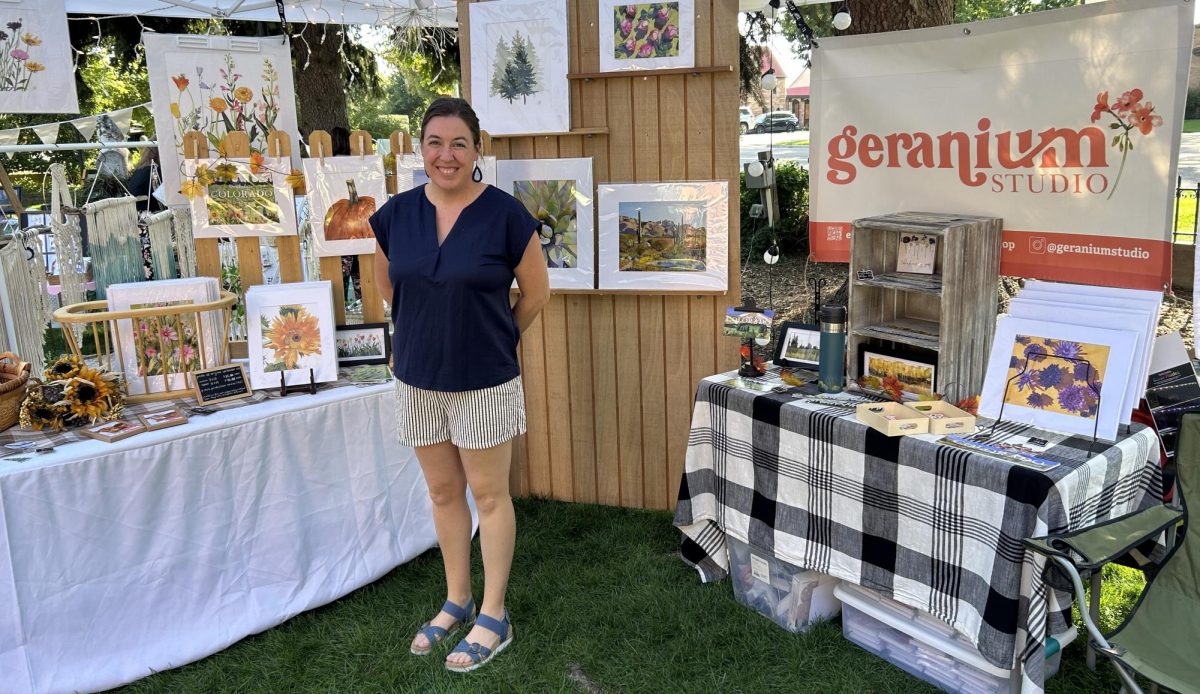 Ms. Helmus posing next to her art boutique. Photo courtesy of Jason Helmus.